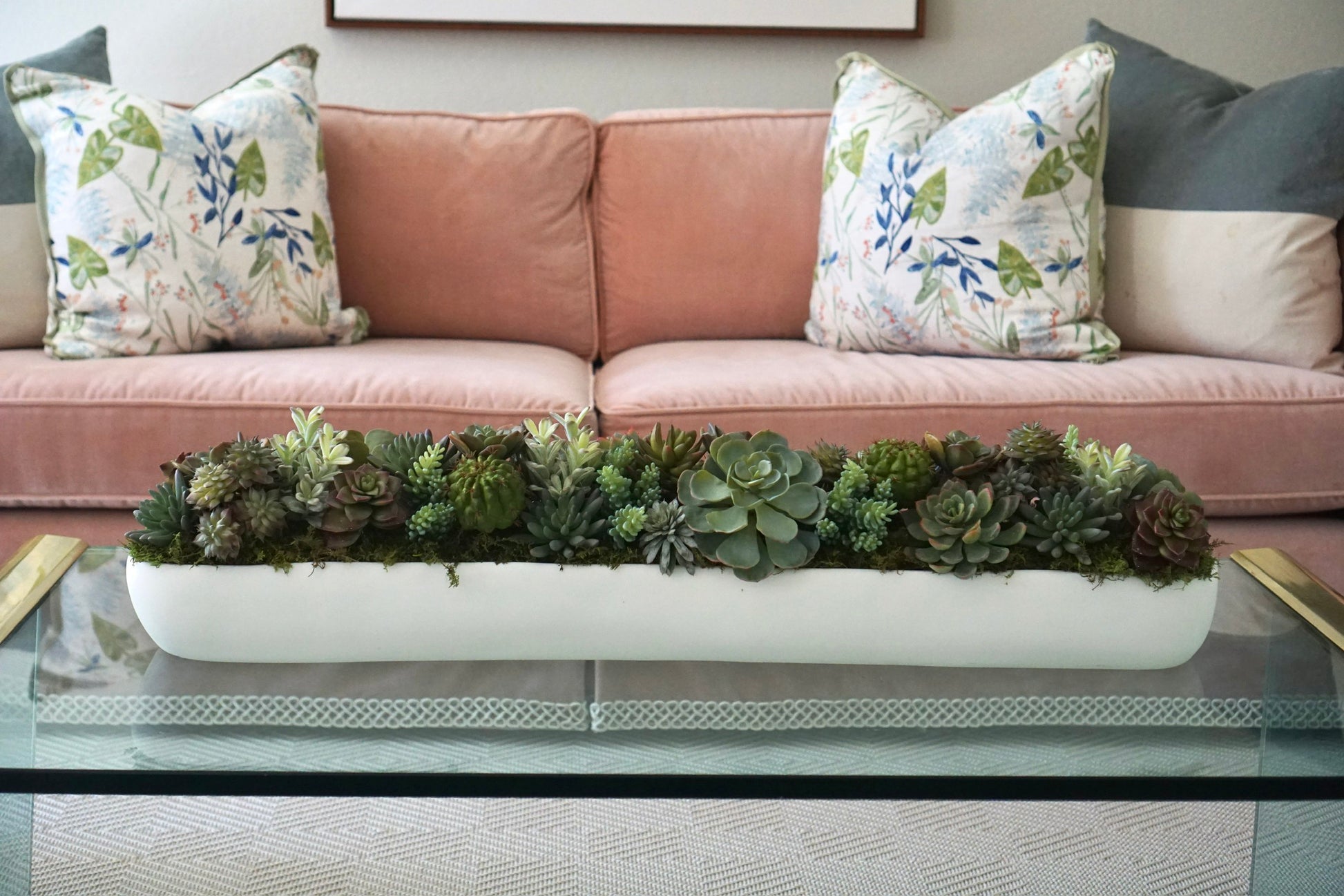 A long, elegant design of all faux succulents. A statement piece for a coffee table or dining room table.