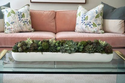 A long, elegant design of all faux succulents. A statement piece for a coffee table or dining room table.